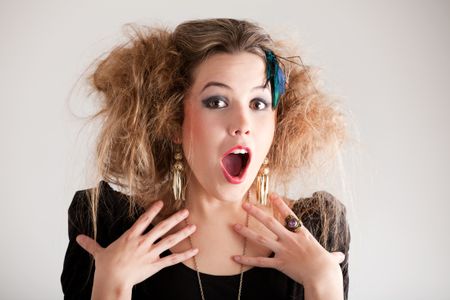 Portrait of a surprised woman with a messy hairdo