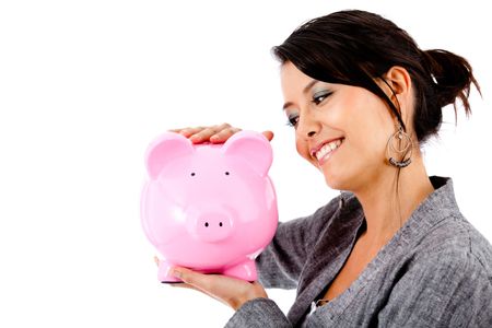 Happy woman with her savings in a piggy bank - isolated