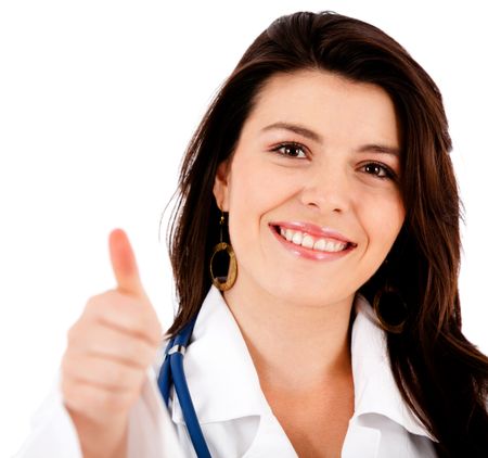 Friendly female doctor with thumbs up - isolated over white