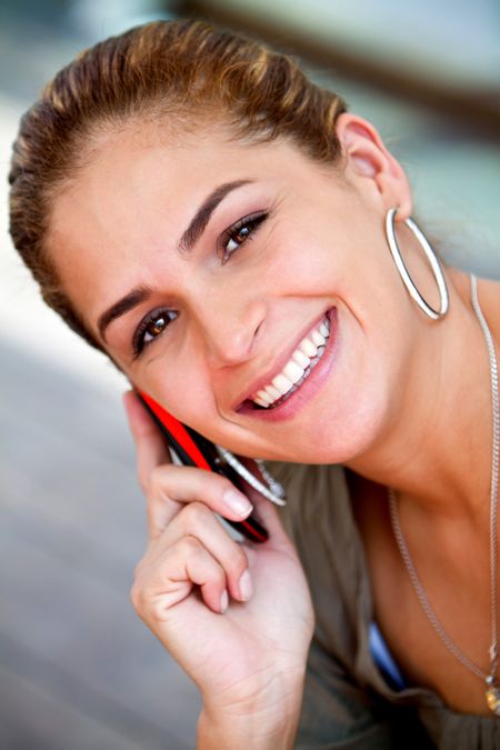 Beautiful woman talking on her cell phone