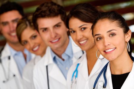 Friendly group of doctors in a row at the hospital