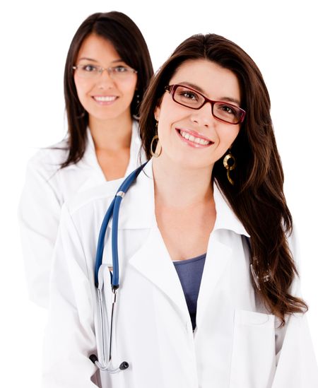 Friendly female doctors smiling - isolated over white