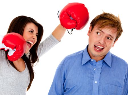Woman punching a guy with a boxing glove ? isolated over white