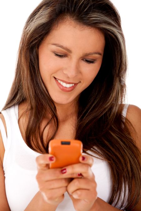 Woman text messaging on her mobile ? isolated over white