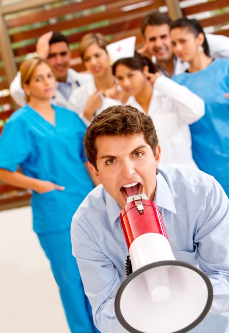 Patient at the hospital shouting on a megaphone to the doctors