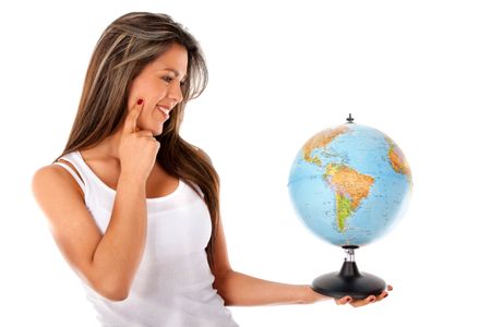 Woman looking at the globe - isolated over a white background
