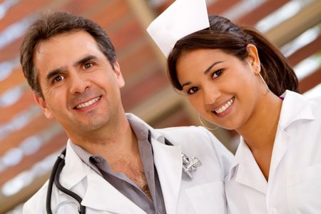 doctor-nurse-hospital-smiling-73140619 Doctor and nurse at the hospital smiling