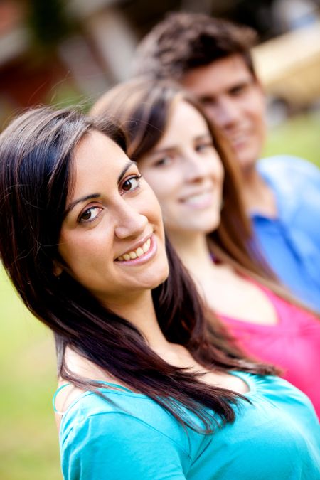 woman-standing-group-people-row-73140682 Woman standing out from a group of people in a row