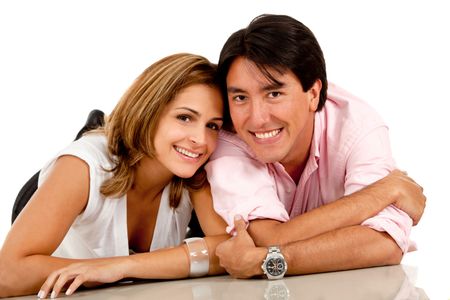 Beautiful loving couple lying on the floor - isolated