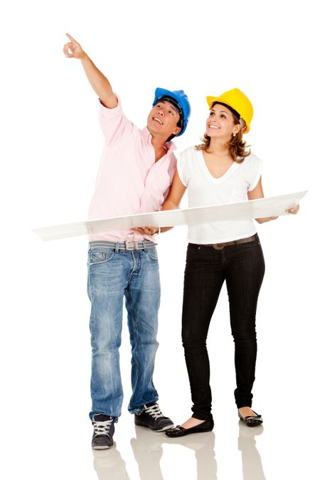 Couple of architects with blueprints or a mock-up - isolated over white
