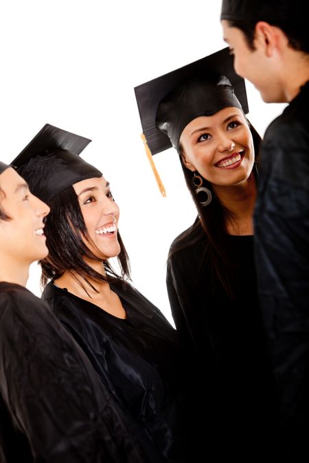 Group of graduates wearing a gown and mortarboard talking- isolated