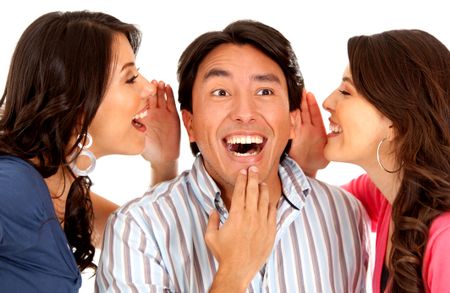 Women telling a secret to a surprised man - isolated over white