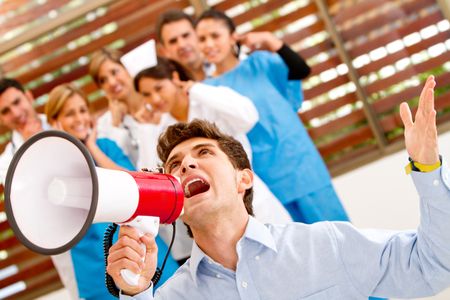 Patient screaming for help with a megaphone at the hospital