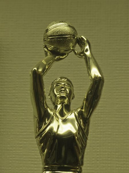 Detail of trophy for women's basketball on display in trophy case