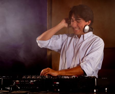 DJ at a disco playing music - party time