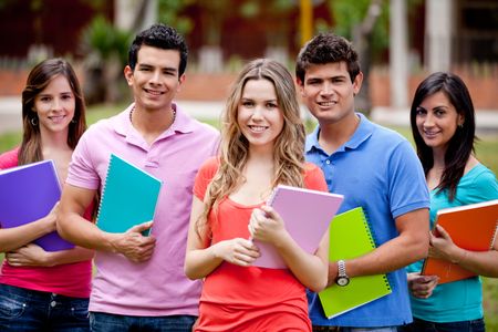 Group of students with a notebook outdoors