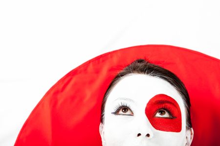 Japanese woman with the flag painted on her face