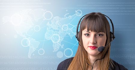 Young female telemarketer with blue background and world map and numbers behind her