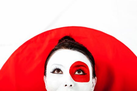 Japanese woman with the flag painted on her face