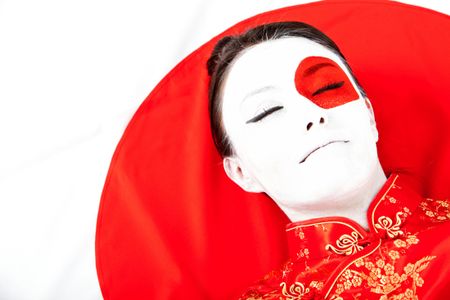 Japanese woman with the flag painted on her face