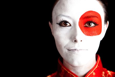 Japanese woman in Asian outfit with the flag painted on her face
