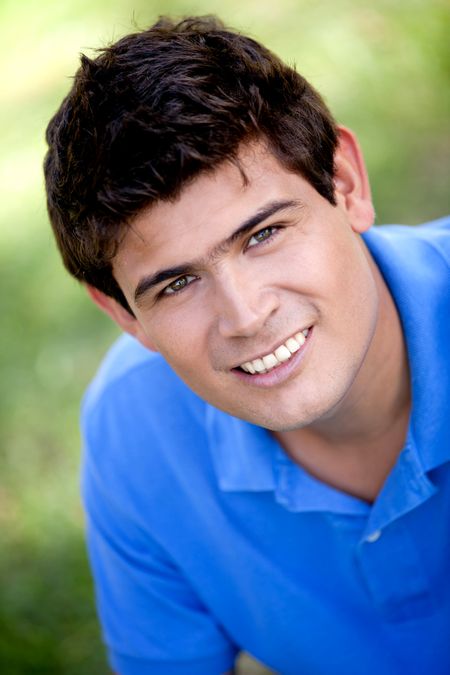 portrait-casual-man-smiling-outdoors-74199739 Portrait of a casual man smiling outdoors
