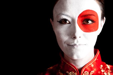 Japanese woman in Asian outfit with the flag painted on her face