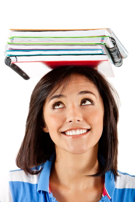 Pensive student balancing books on top of her head - isolated