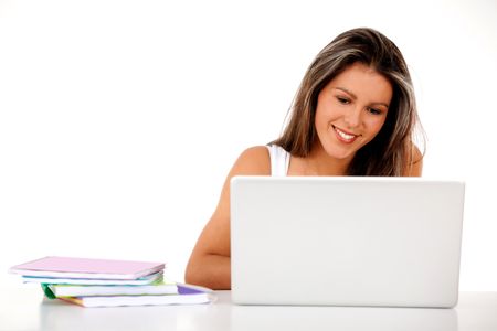 Happy female student with a laptop and notebooks ? isolated