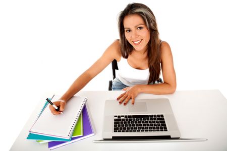 Happy female student with a laptop and notebooks ? isolated