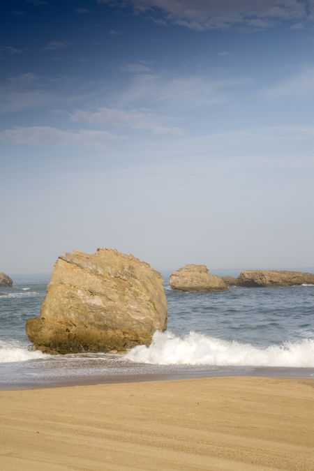 Rock and Sufer on Beach; Biarritz; France