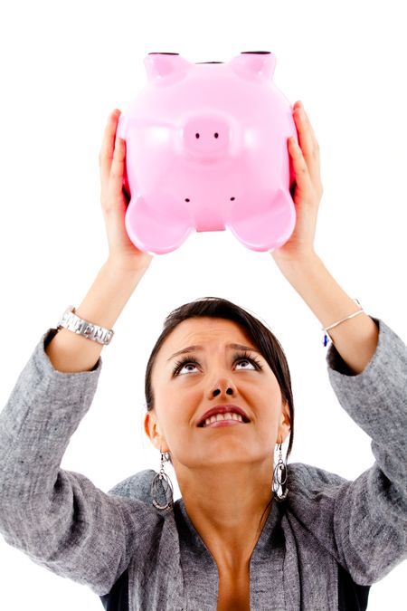 desperate-woman-trying-money-piggybank-isolated-75026899 Desperate woman trying to take money out of a piggybank - isolated