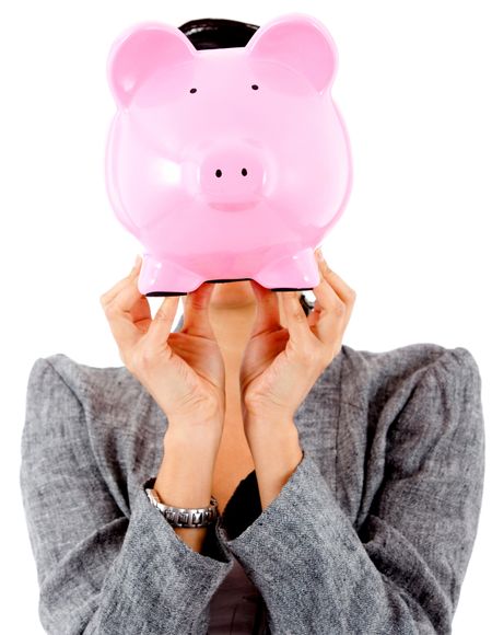 Woman with her savings in a piggy bank covering her face- isolated