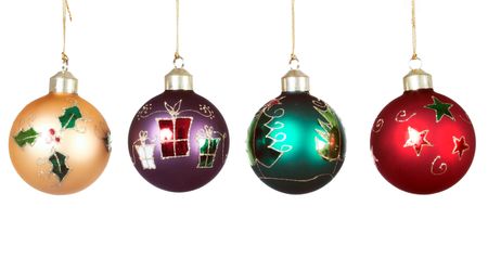 Christmas balls hanging over a white background