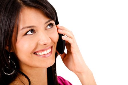 Beautiful woman talking on the phone - isolated over white