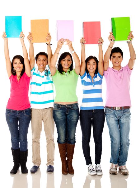 Group of students with arms up holding notebooks - isolated over white