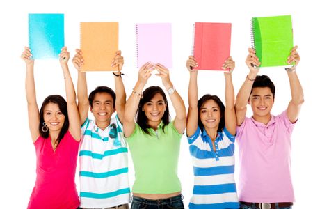 Group of students with arms up holding notebooks - isolated over white