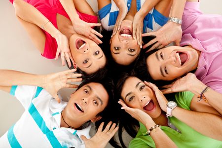 Group of people lying on the floor making surprised faces