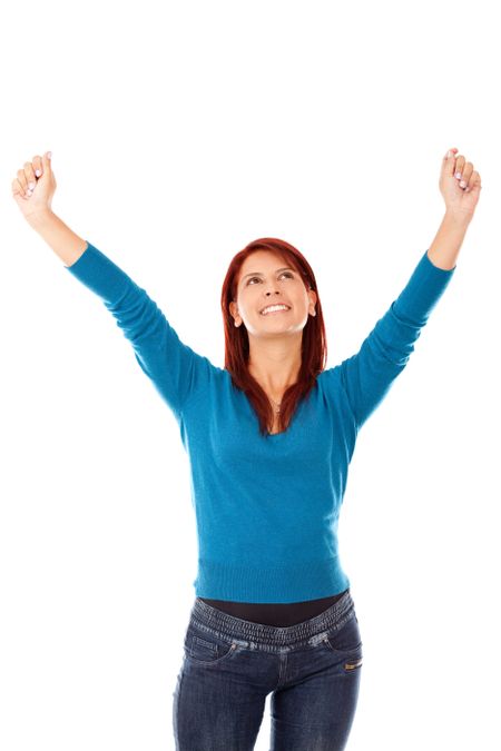 Happy woman with arms up - isolated over a white background