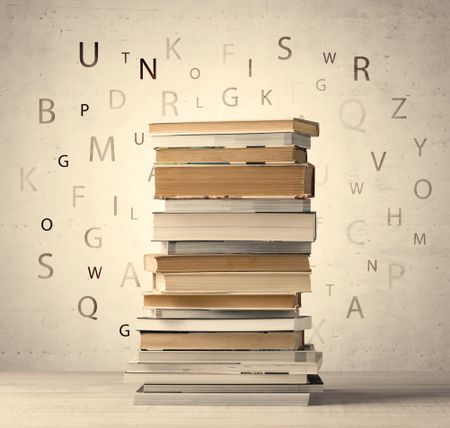 Books with flying letters on vintage old background