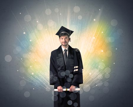 Happy graduate with colorful bokeg lights in the background grunge wall