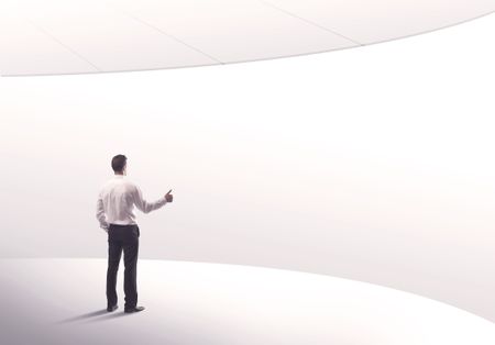 Young sales business person in elegant suit standing with his back in empty white space background with curved lines concept