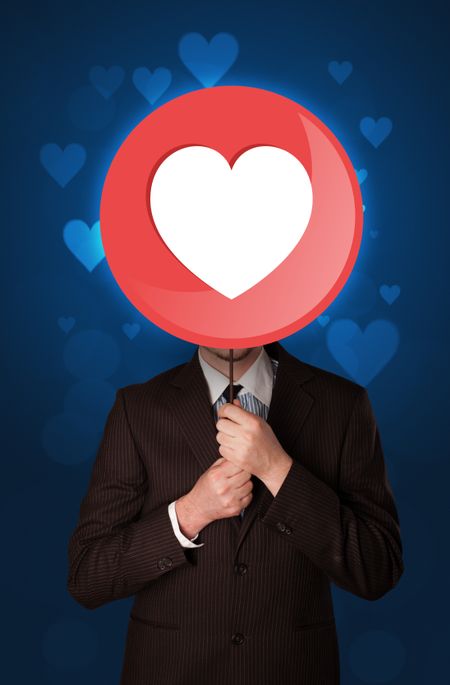 Smart businessman holding round sign with heart 
