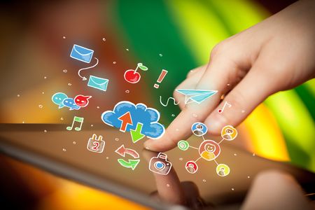Female hands touching tablet with colorful social media icons