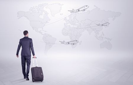 Businessman in dark suit planning his trip in a front of a map
