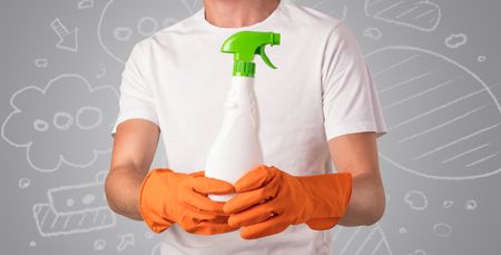 Male housekeeper with and without head with grey doodled wallpaper
