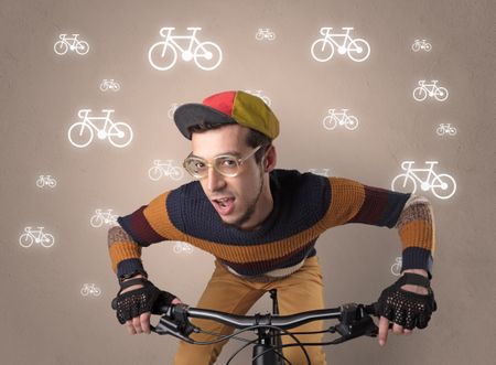 Young ridiculous biker with line drawn bikes on the background