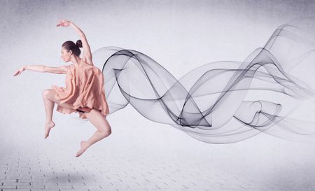 Modern ballet dancer performing with abstract swirl concept on background