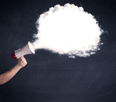Caucasian business hand holding megaphone with white plain message cloud