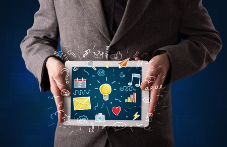 Casual businessman holding tablet with colorful apps 